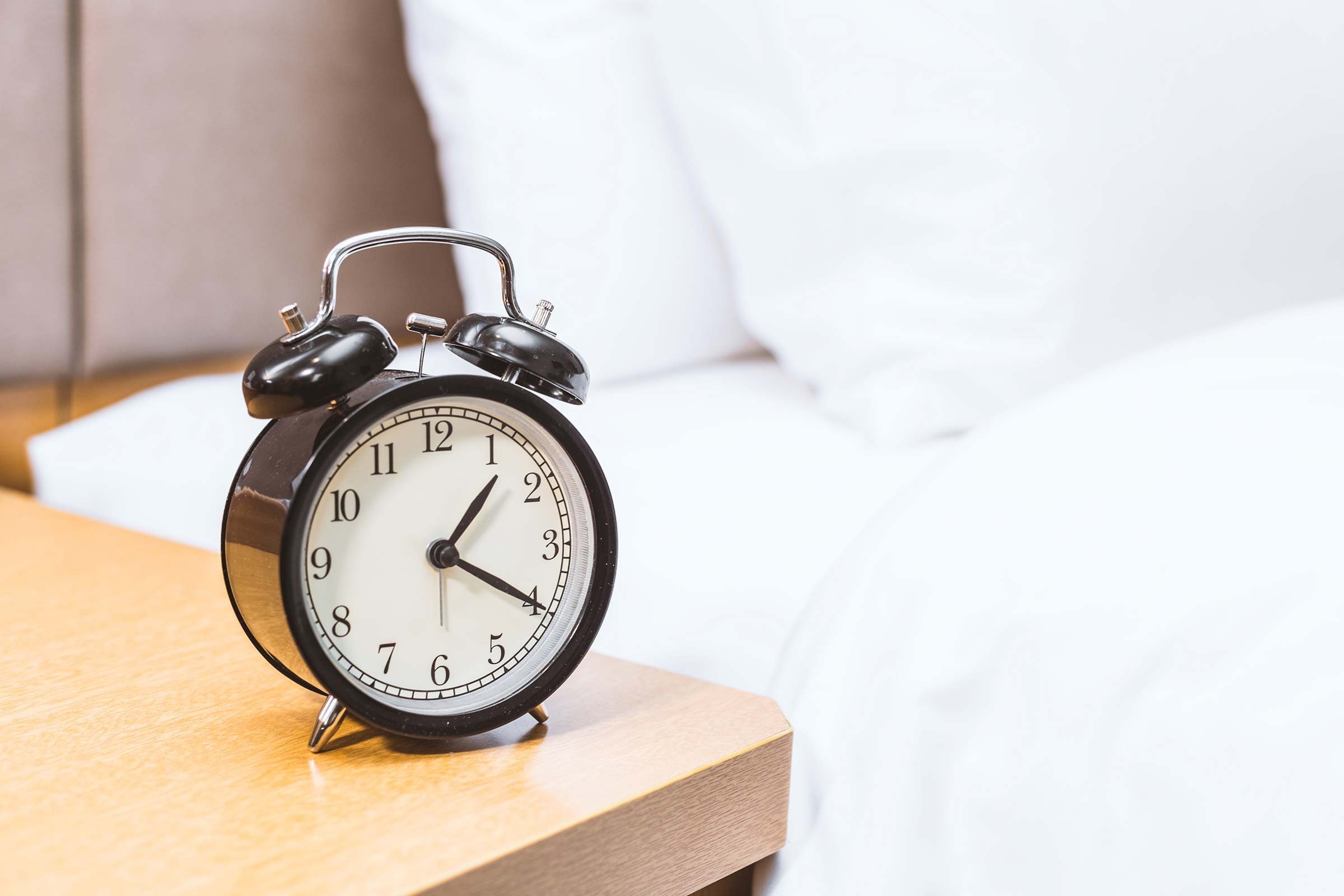 alarm clock on a night table