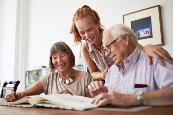 family looking through photo album