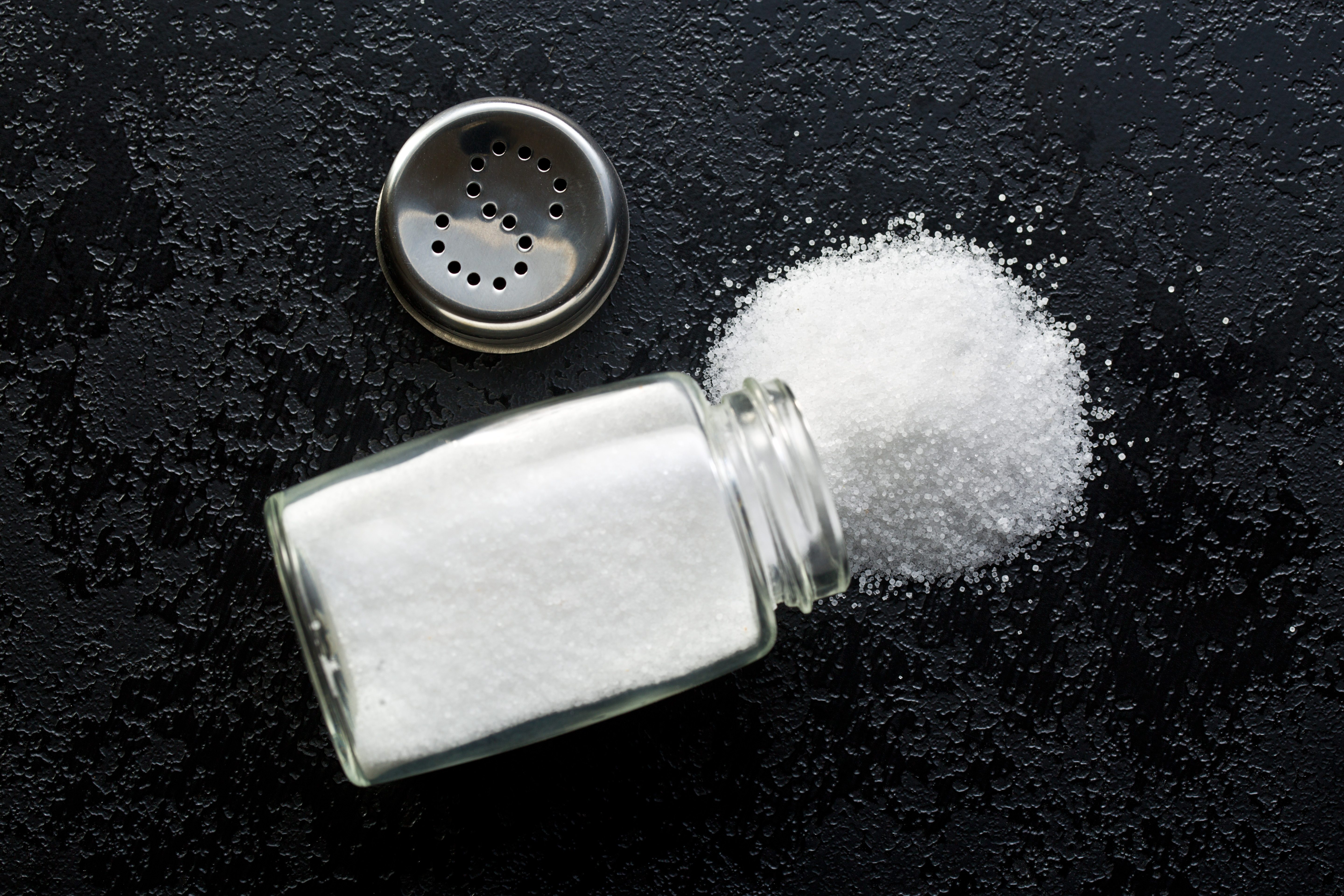 salt shaker on black kitchen table