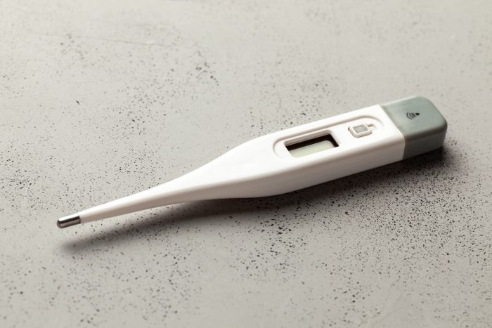 Medical thermometers electronic on gray background. Copy space for text