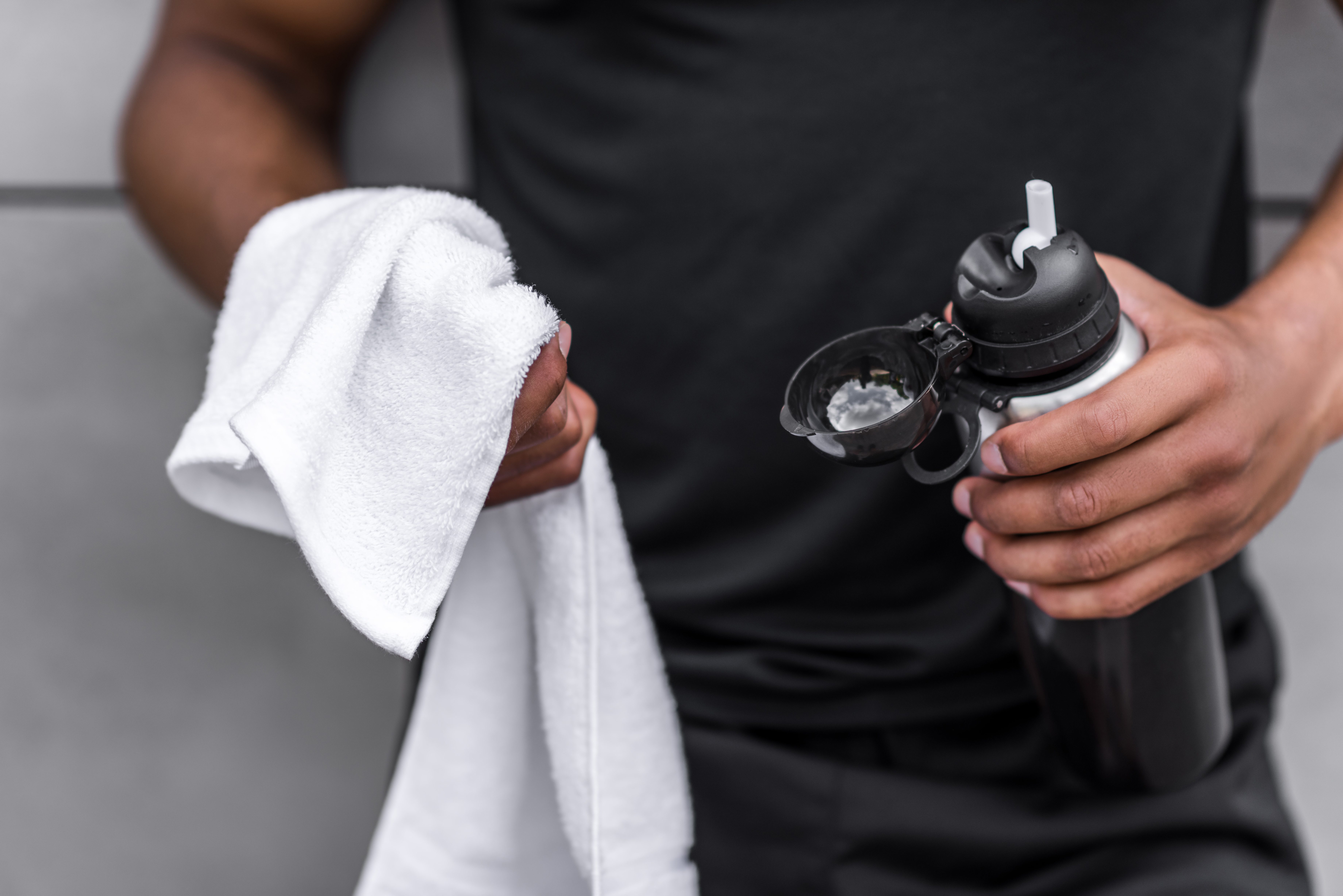 man holding sports bottle