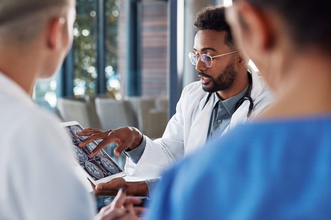 doctors looking at brain scans