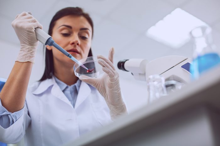 scientist in lab with blood test