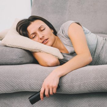 woman sleeping remote tv