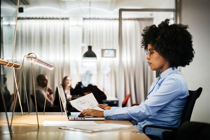 young woman sitting at desk working