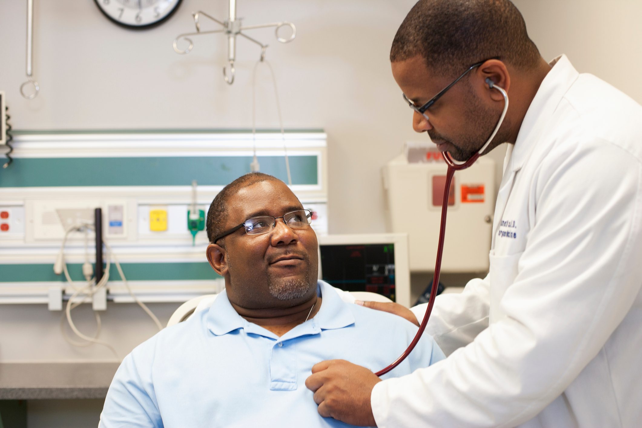 doctor listening to patient's heart