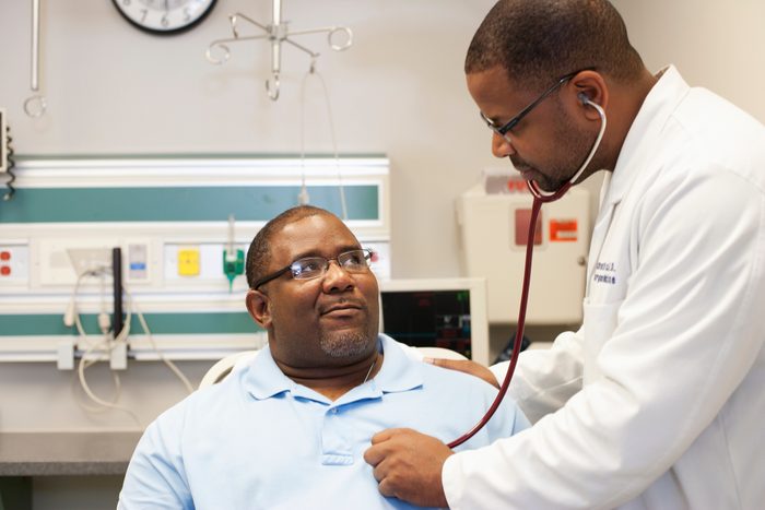 doctor listening to patient's heart
