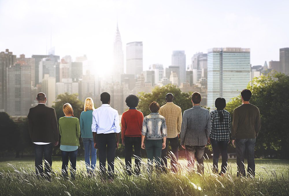 group of people overlooking city view scape