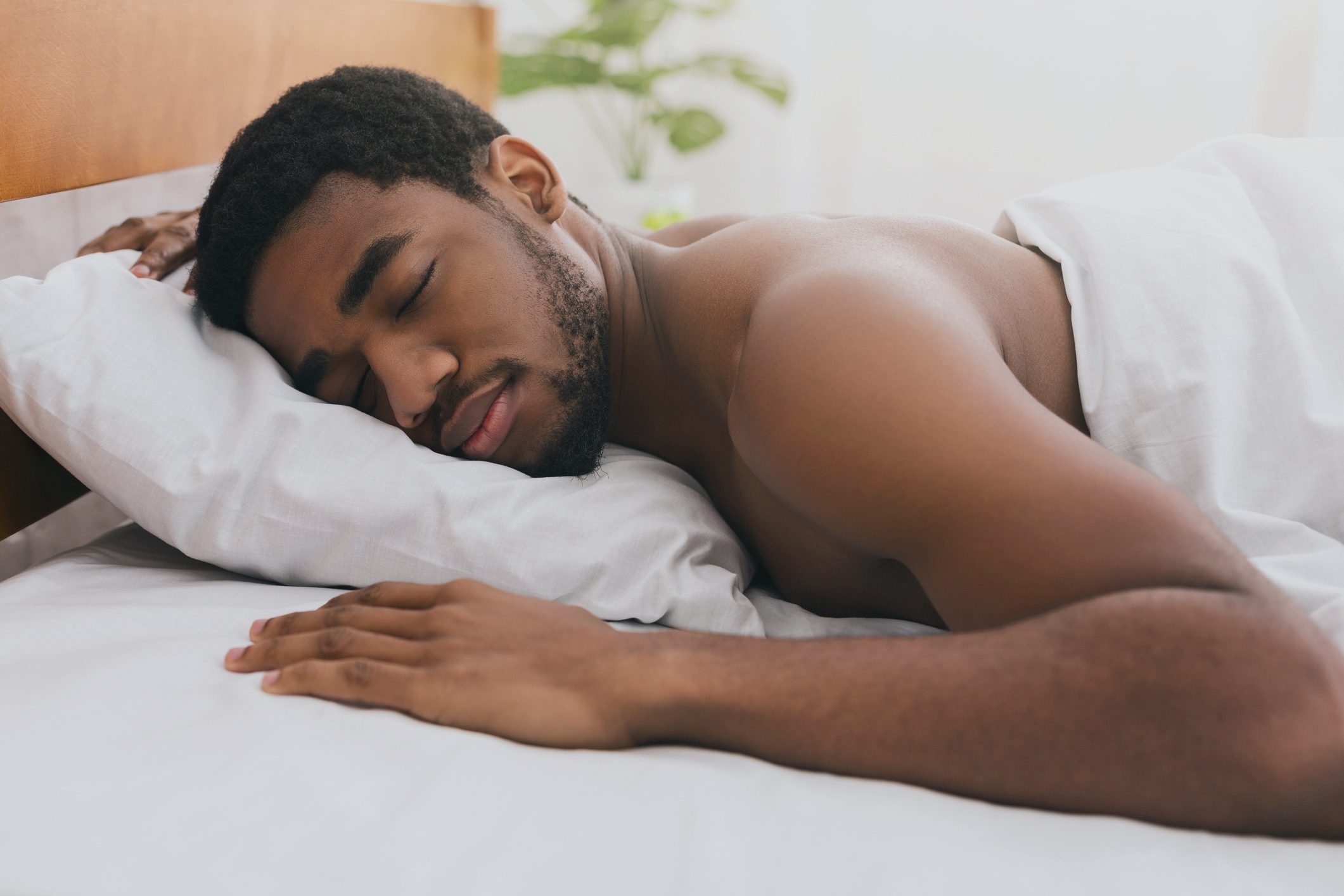 man sleeping in bed