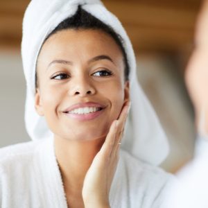 woman looking in mirror