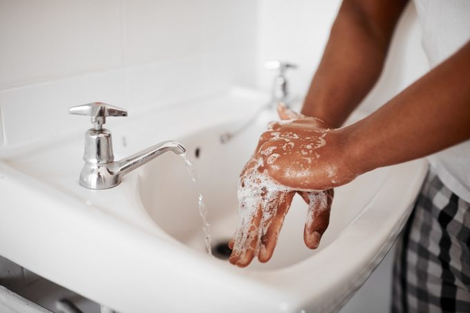 washing hands in bathroom sink