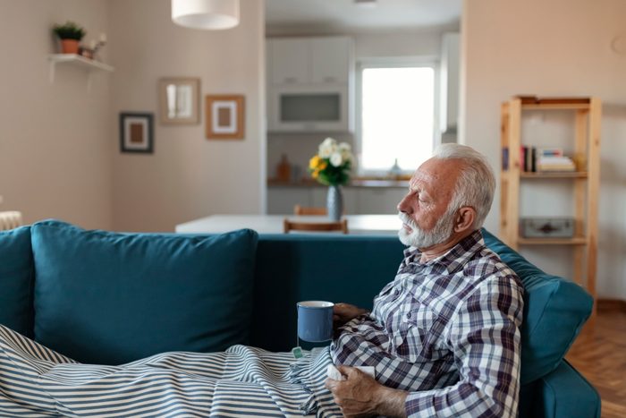 man sick on couch shortness of breath