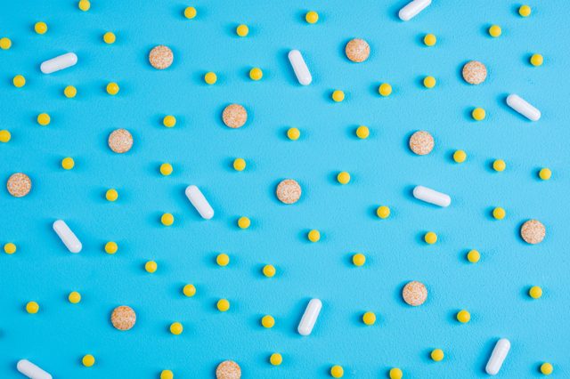 vitamins on blue background