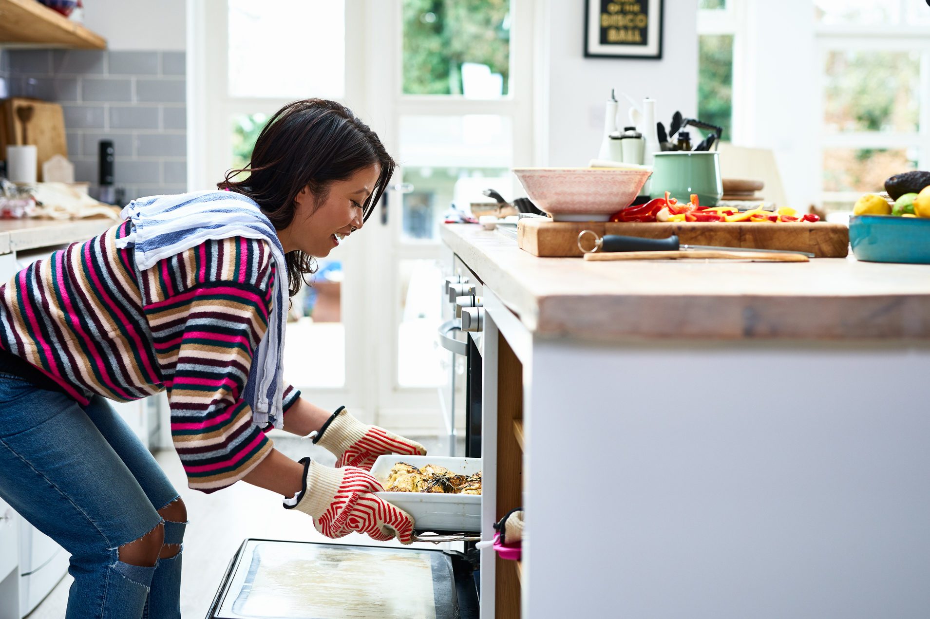 woman cooking food in kitchen