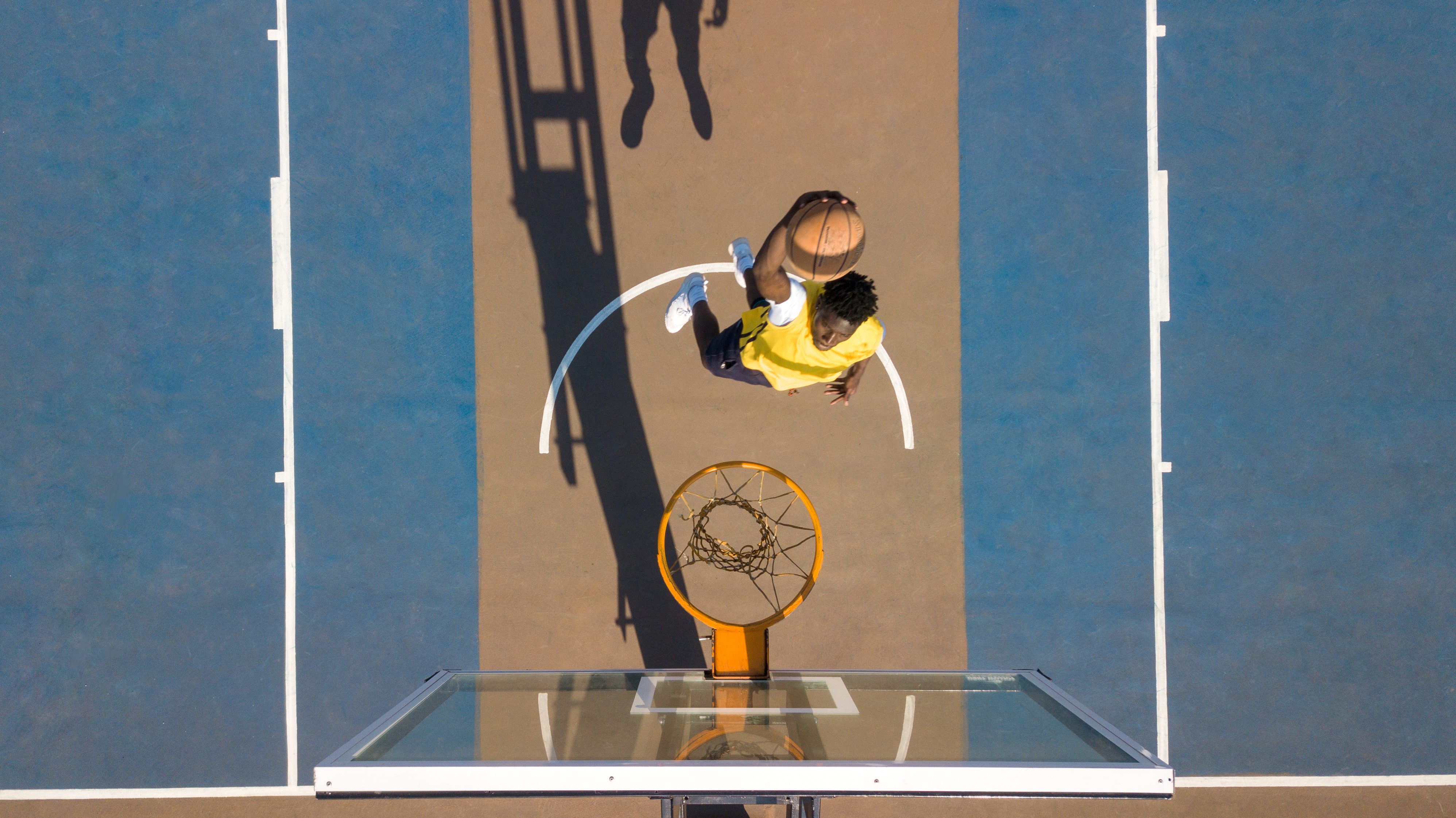 aerial shot of man playing basketball