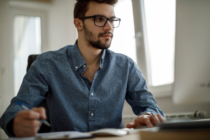 young man working at home