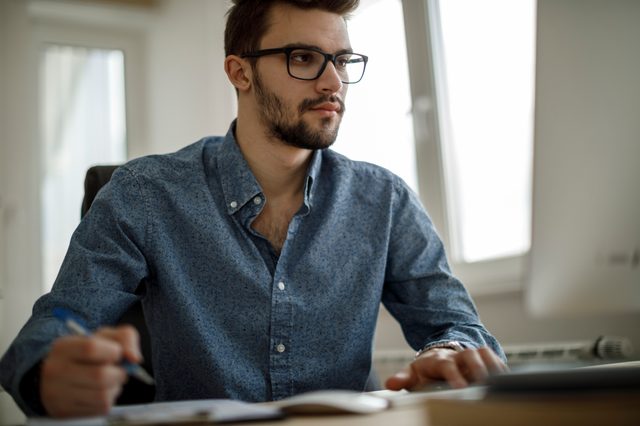 young man working at home
