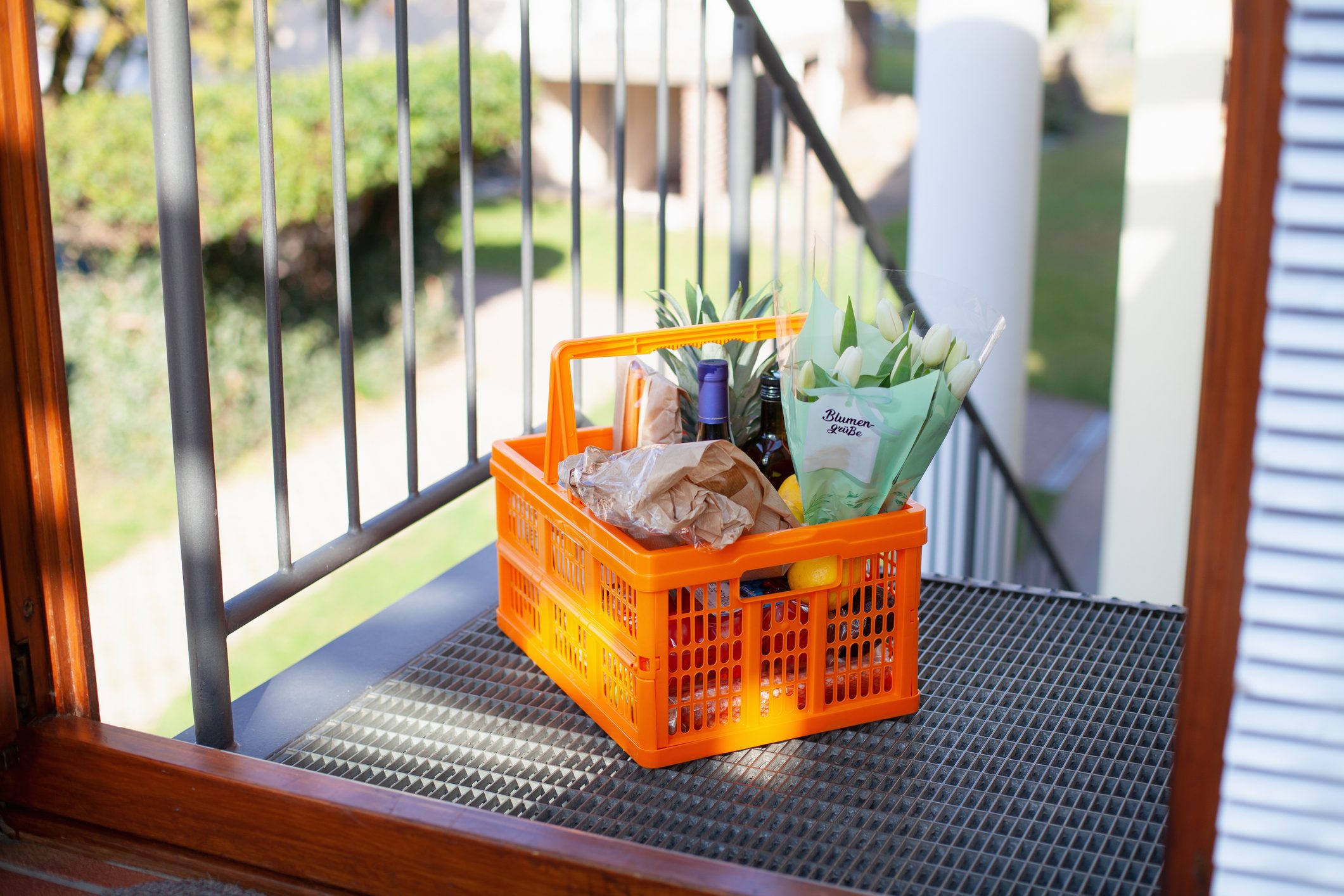 grocery basket outside of home door