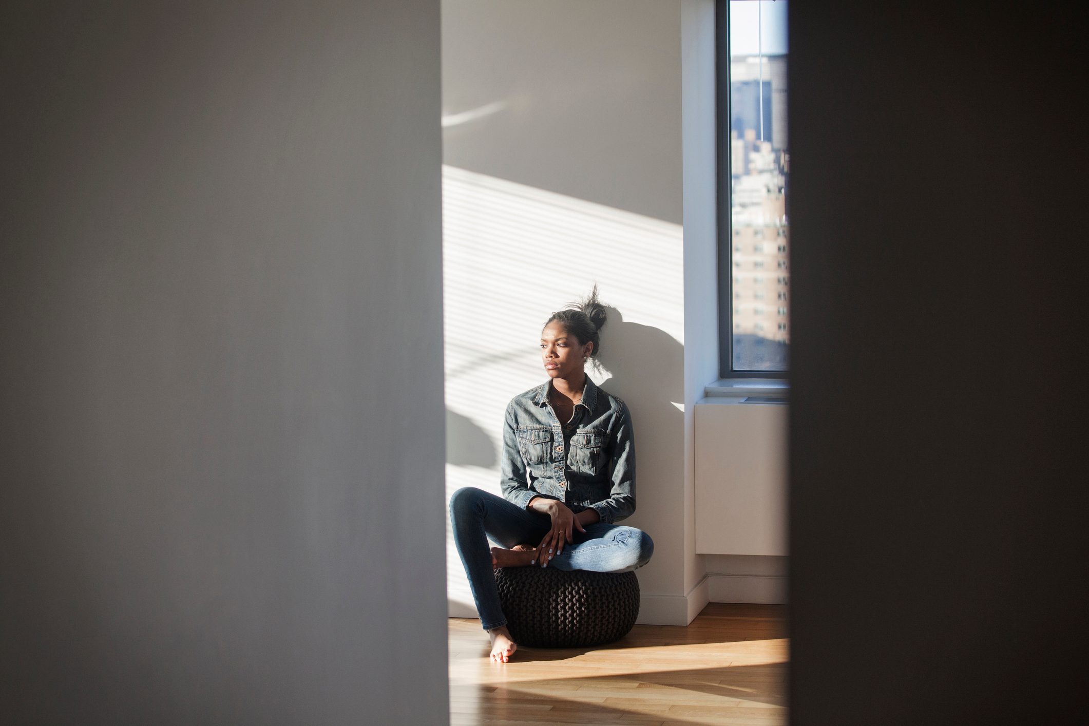 woman sitting at home alone lonely concept