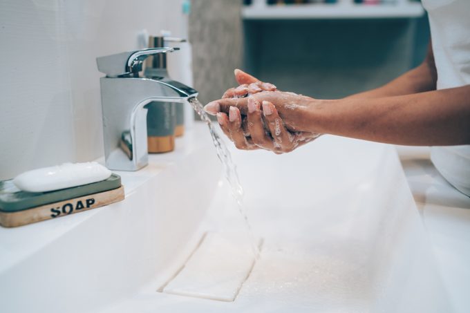 cropped close up shot of woman washing her hands