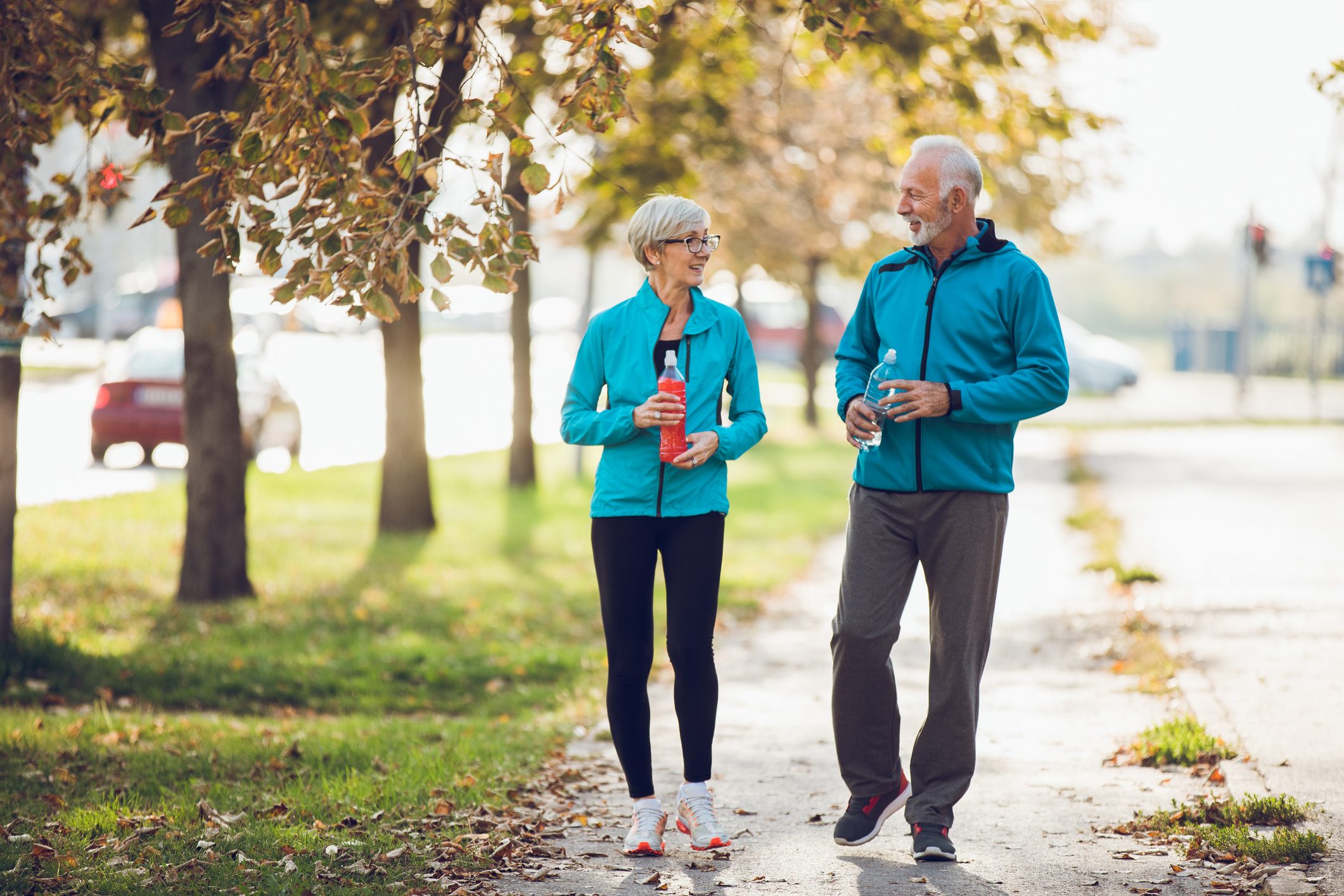 senior couple walking together outside