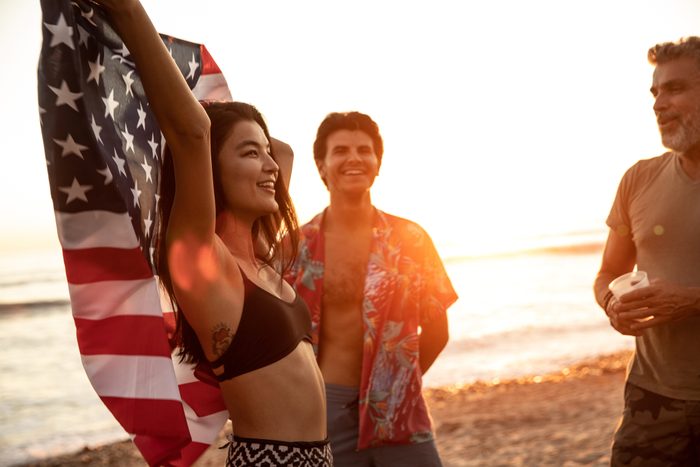 friends on the beach celebrating fourth of july