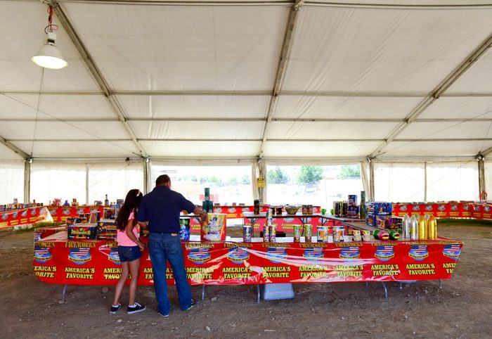 father and daughter shopping for fireworks