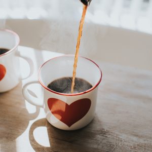 hot coffee being poured into mug