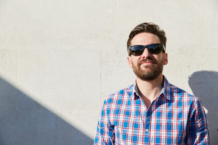 man wearing sunglasses in the sunshine