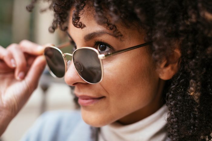 close up of woman wearing sunglasses