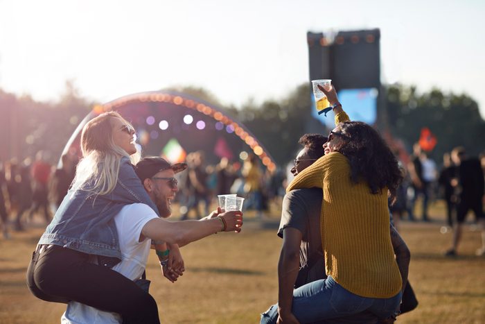 friends at music festival convert