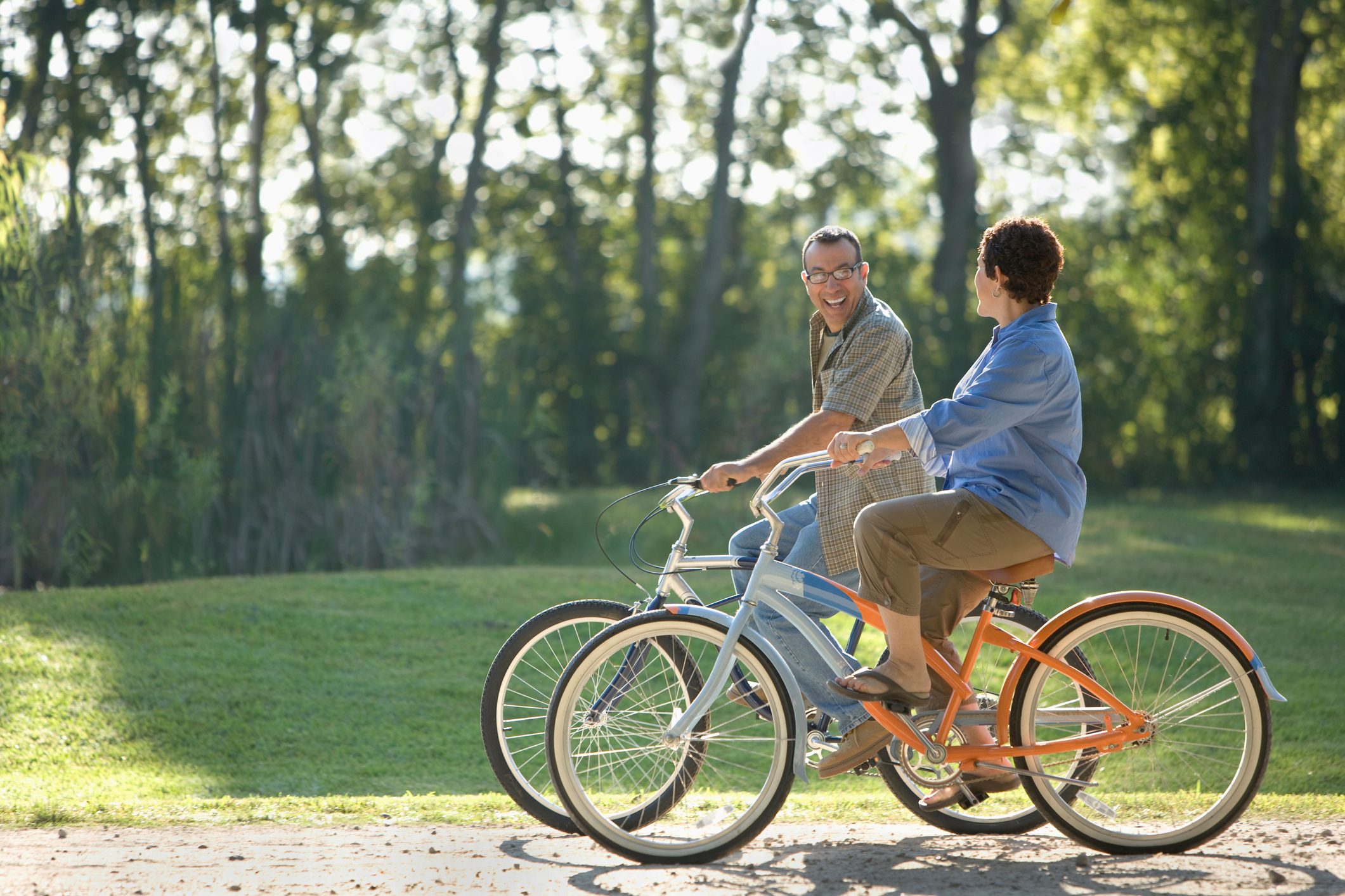 couple riding bikes together on a sunny day