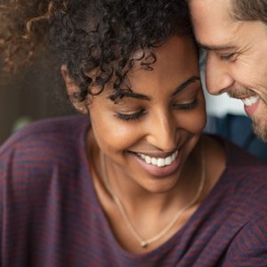 young romantic couple smiling together