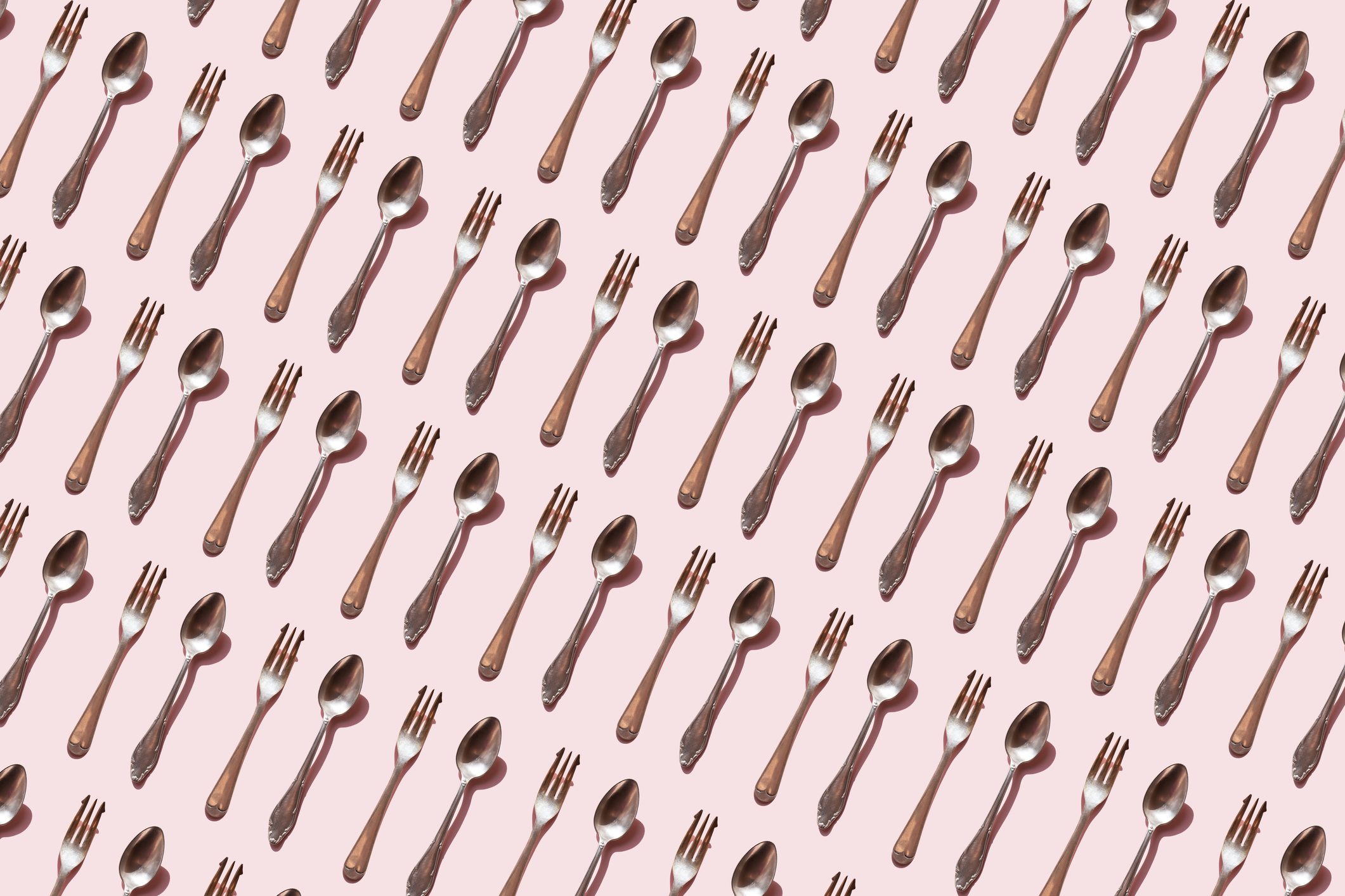 spoon and fork pattern on pink background