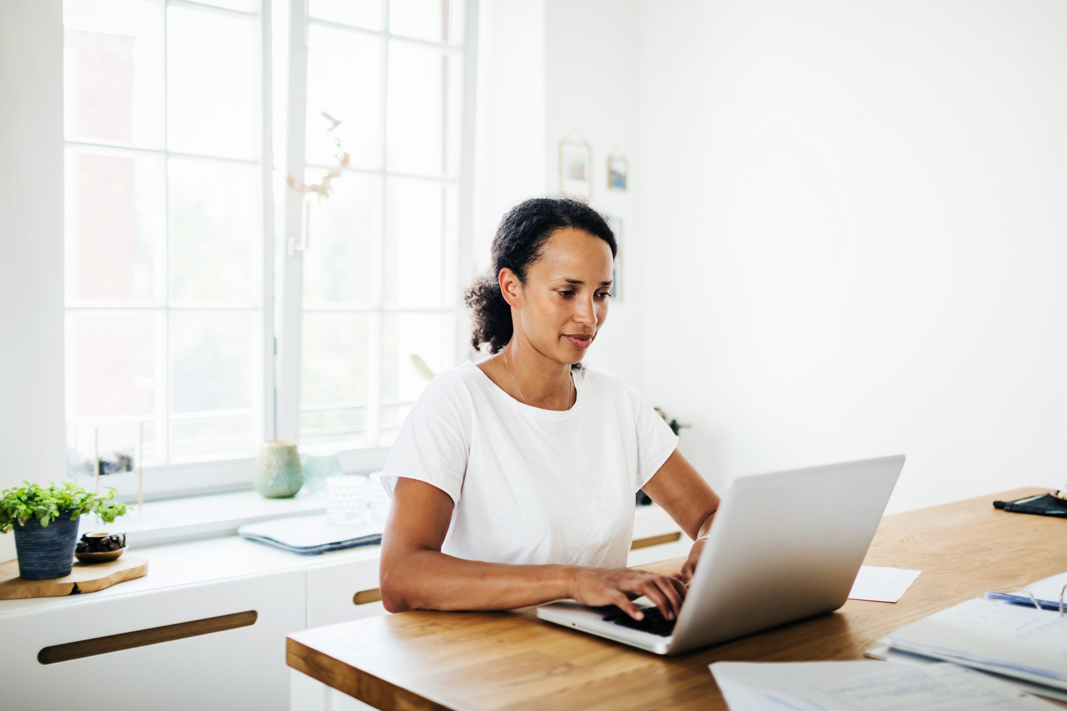 Single Mom Working From Home In Her Kitchen