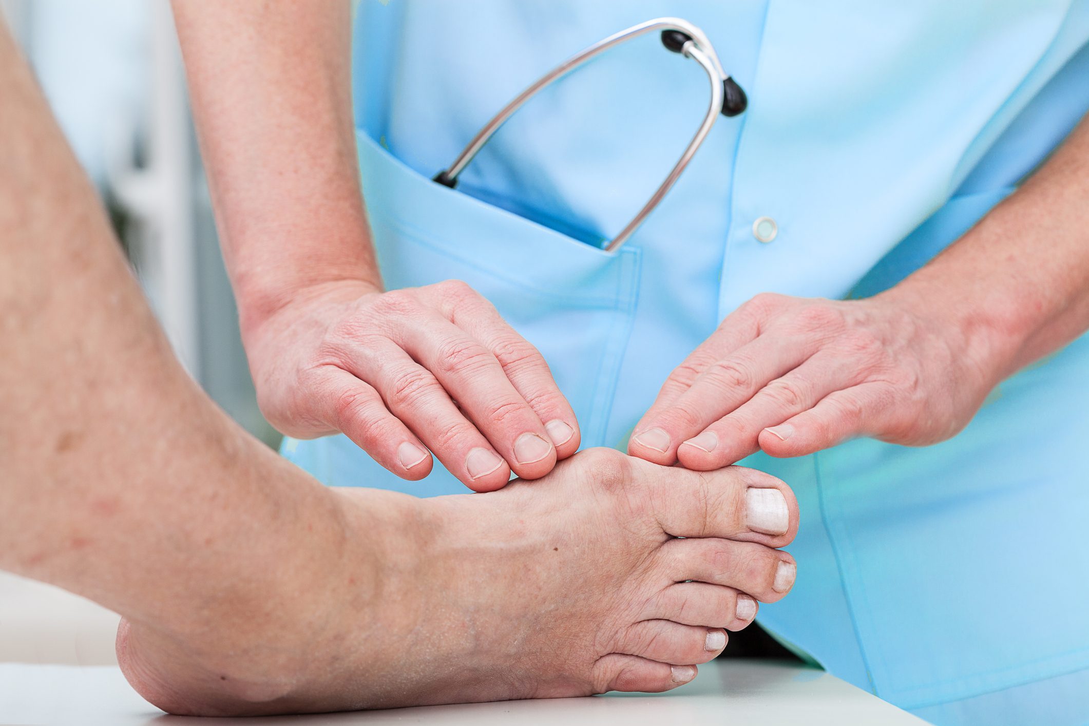 doctor examining patient's foot