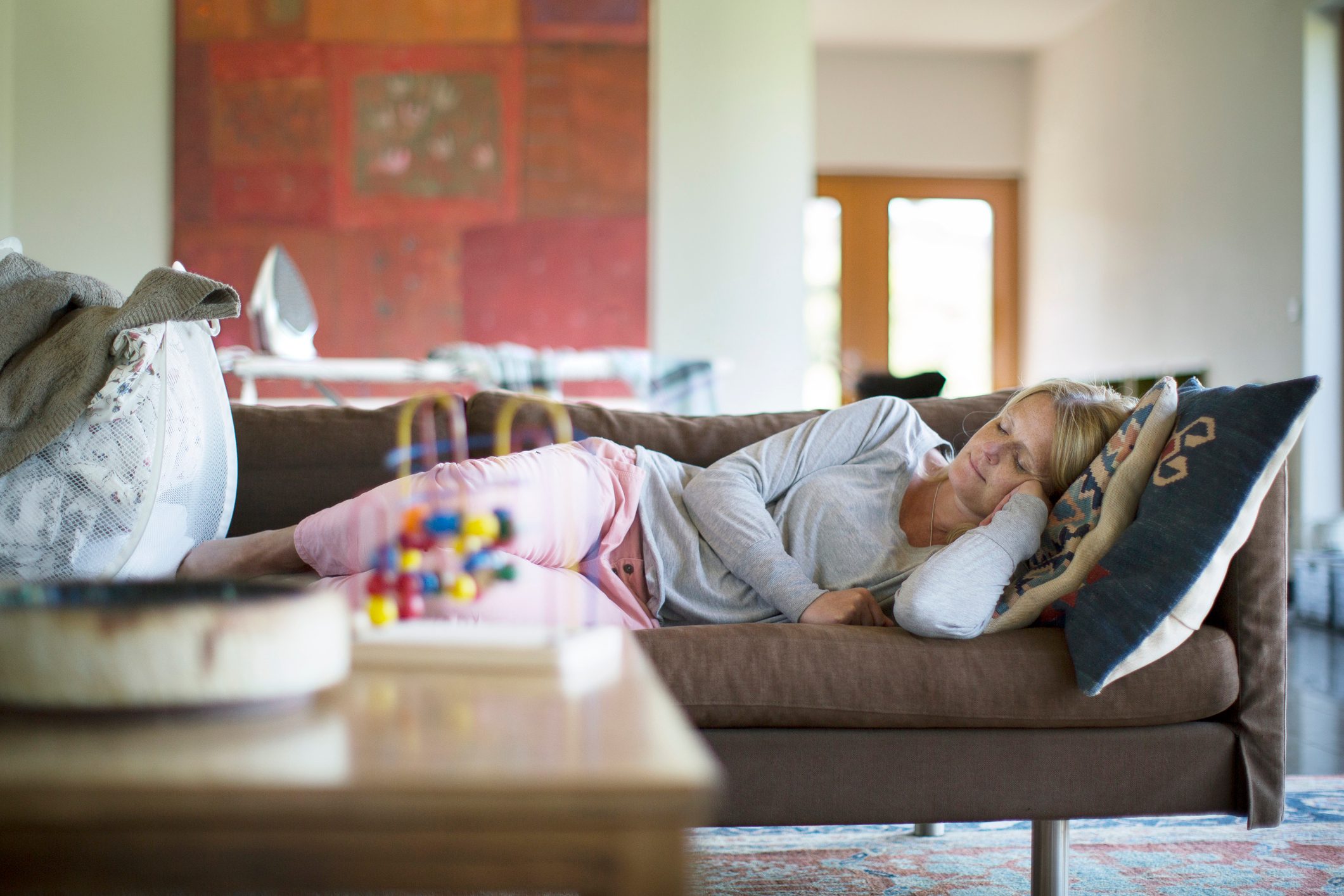 Woman sleeping on sofa