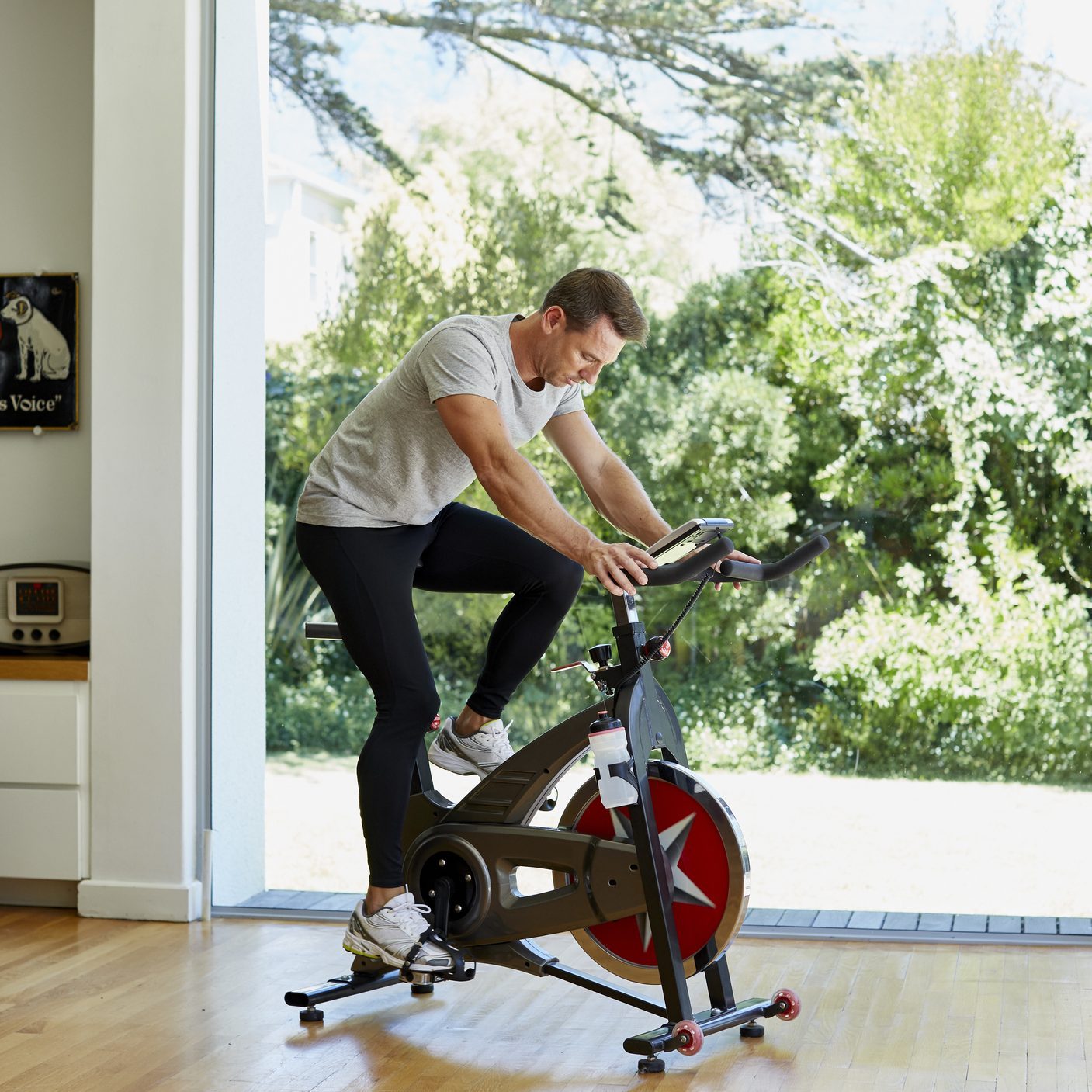 Man working out on exercise bike at home