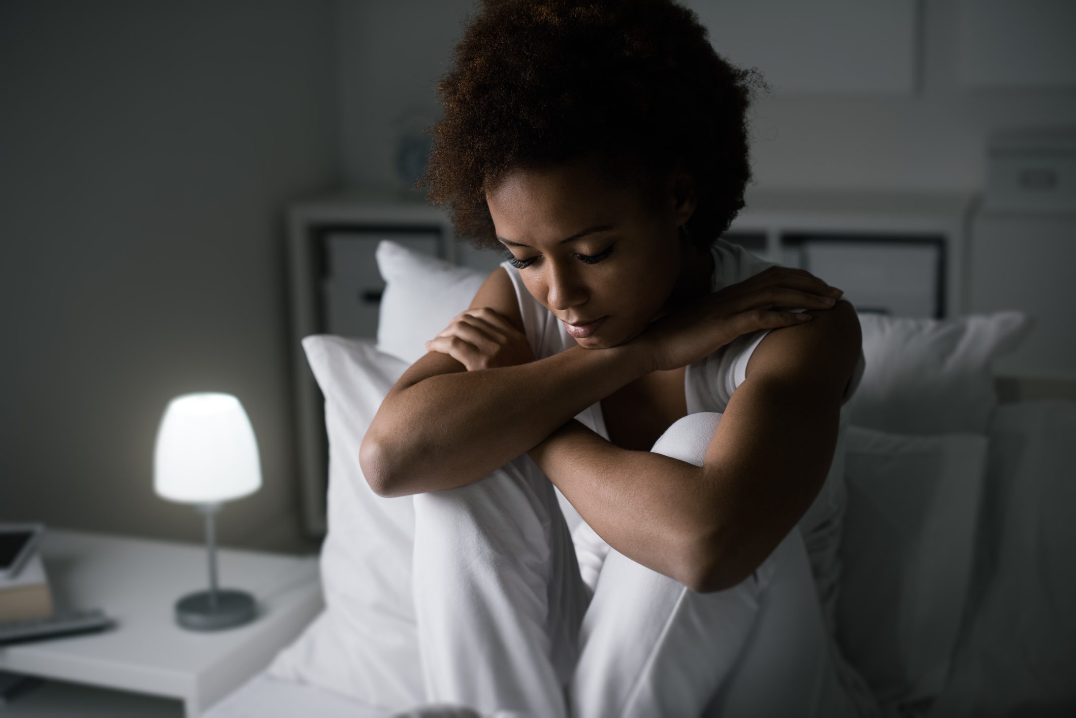Depressed woman in her bed
