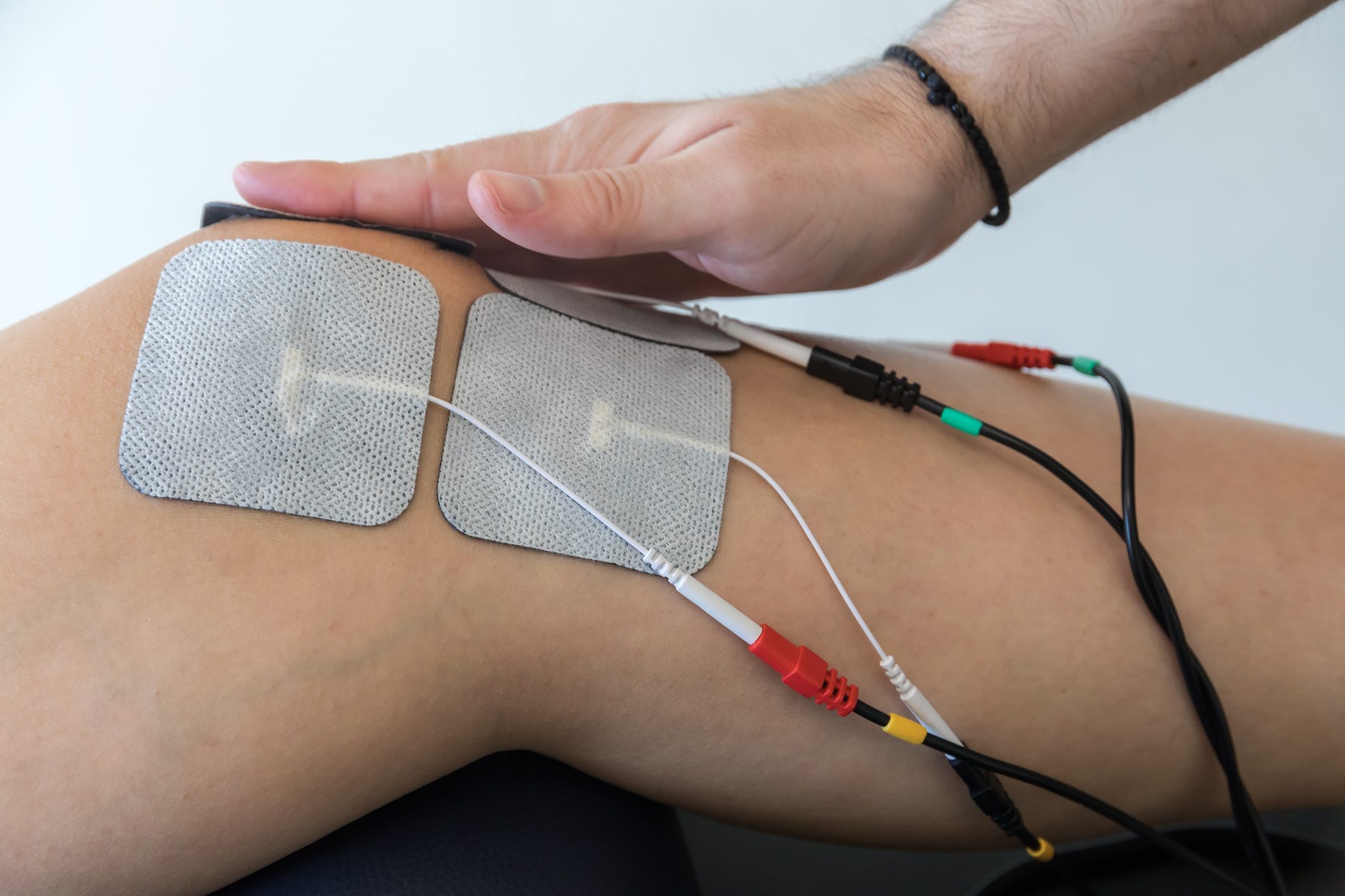 electronic therapy on knee used to treat pain