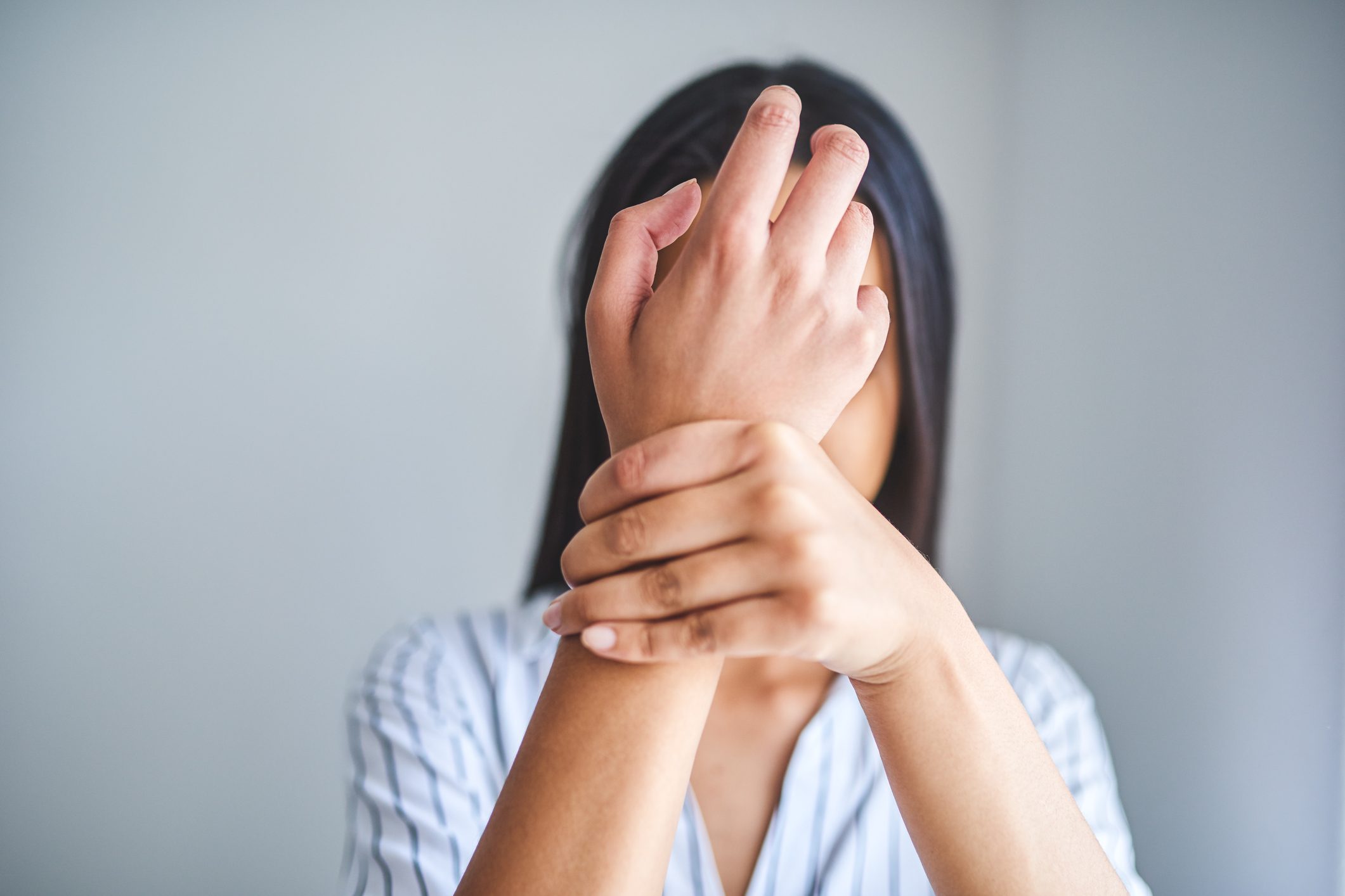woman holding wrist
