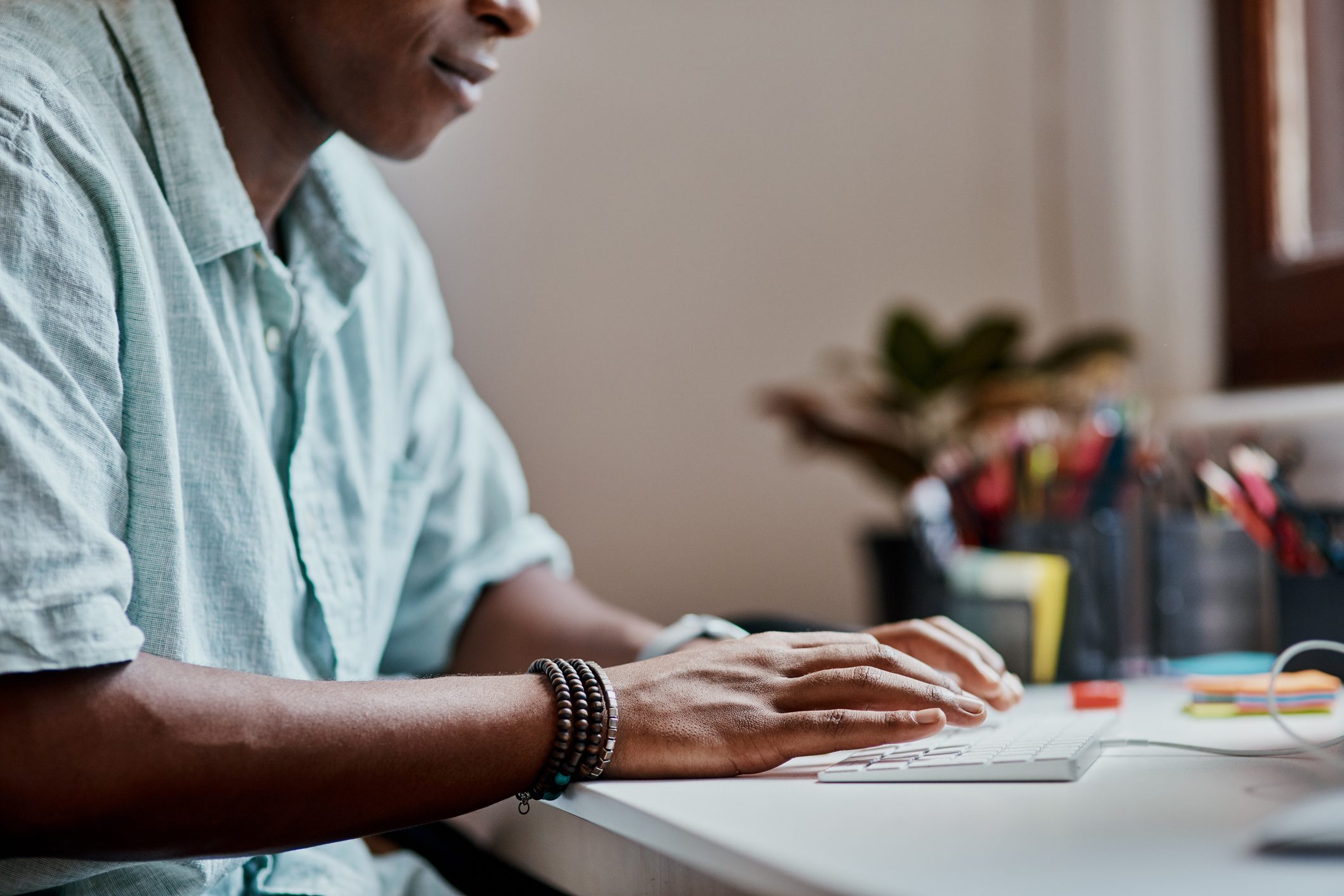man working at keyboard