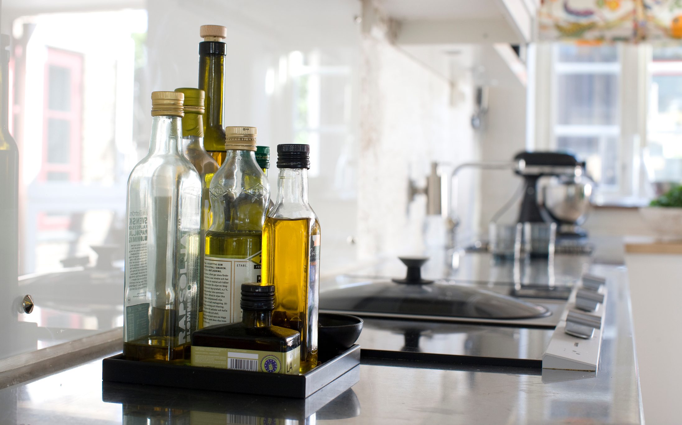 oil Bottles on kitchen worktop, close-up