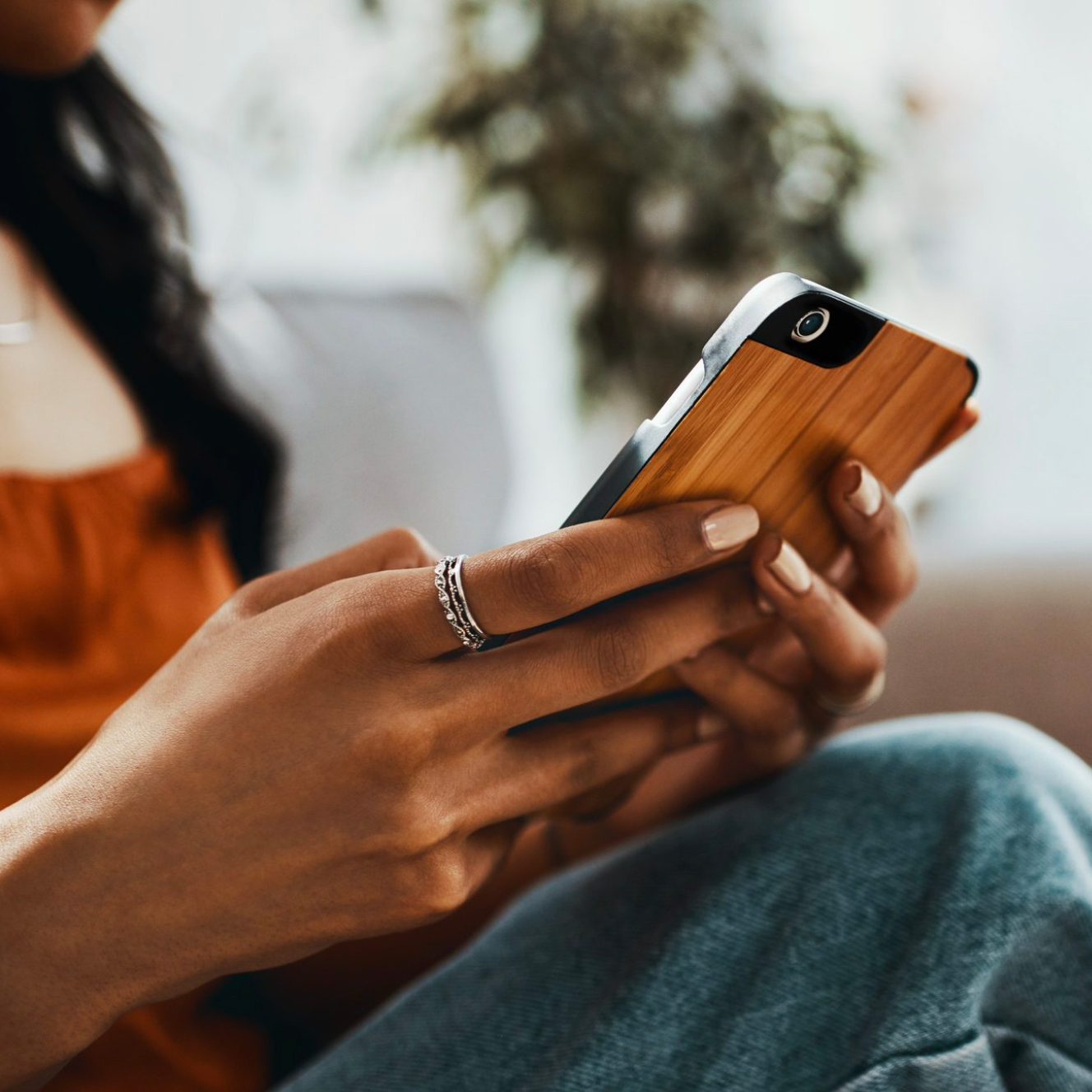 close up of woman holding smart phone