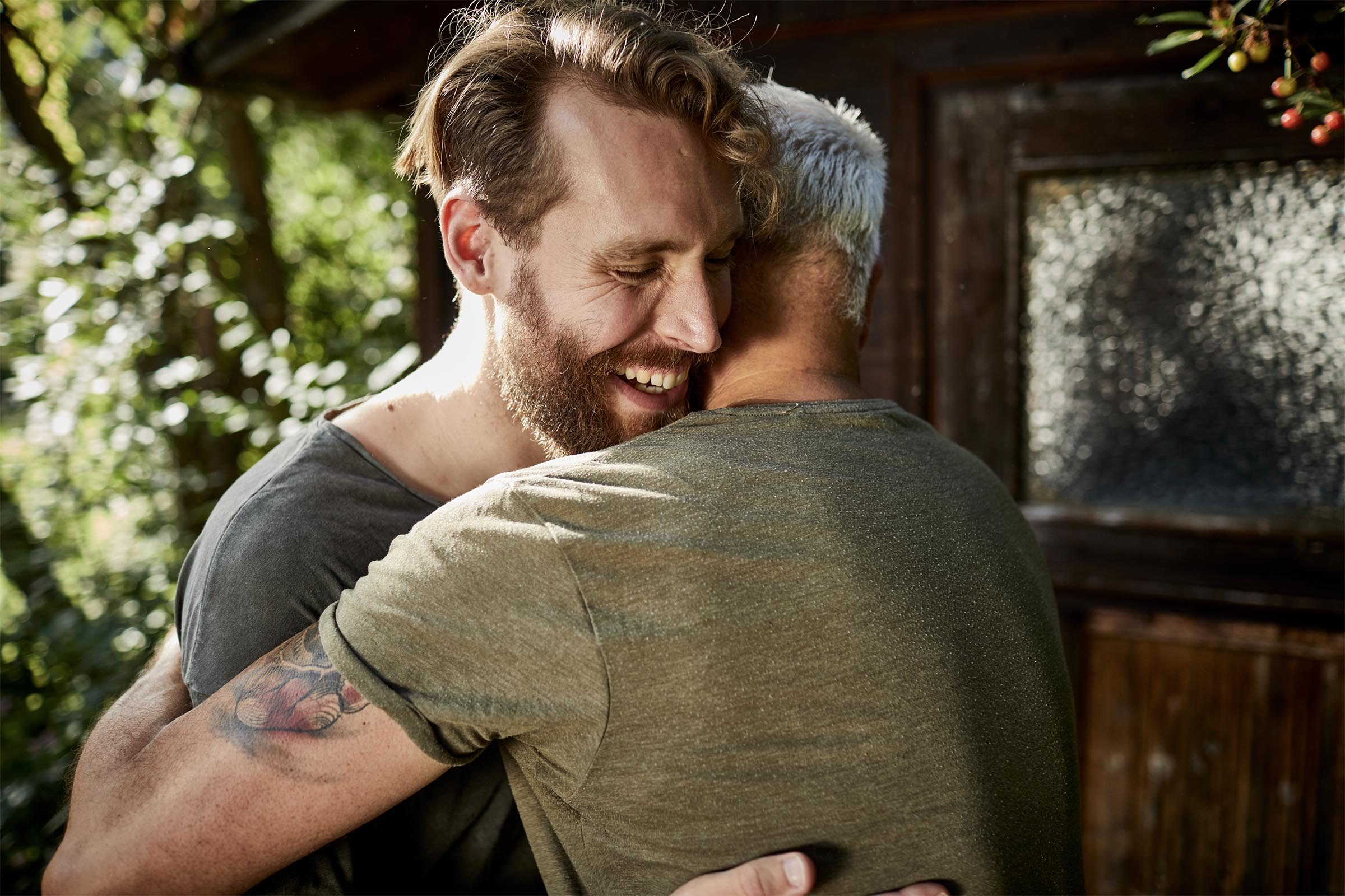 Two happy men embracing