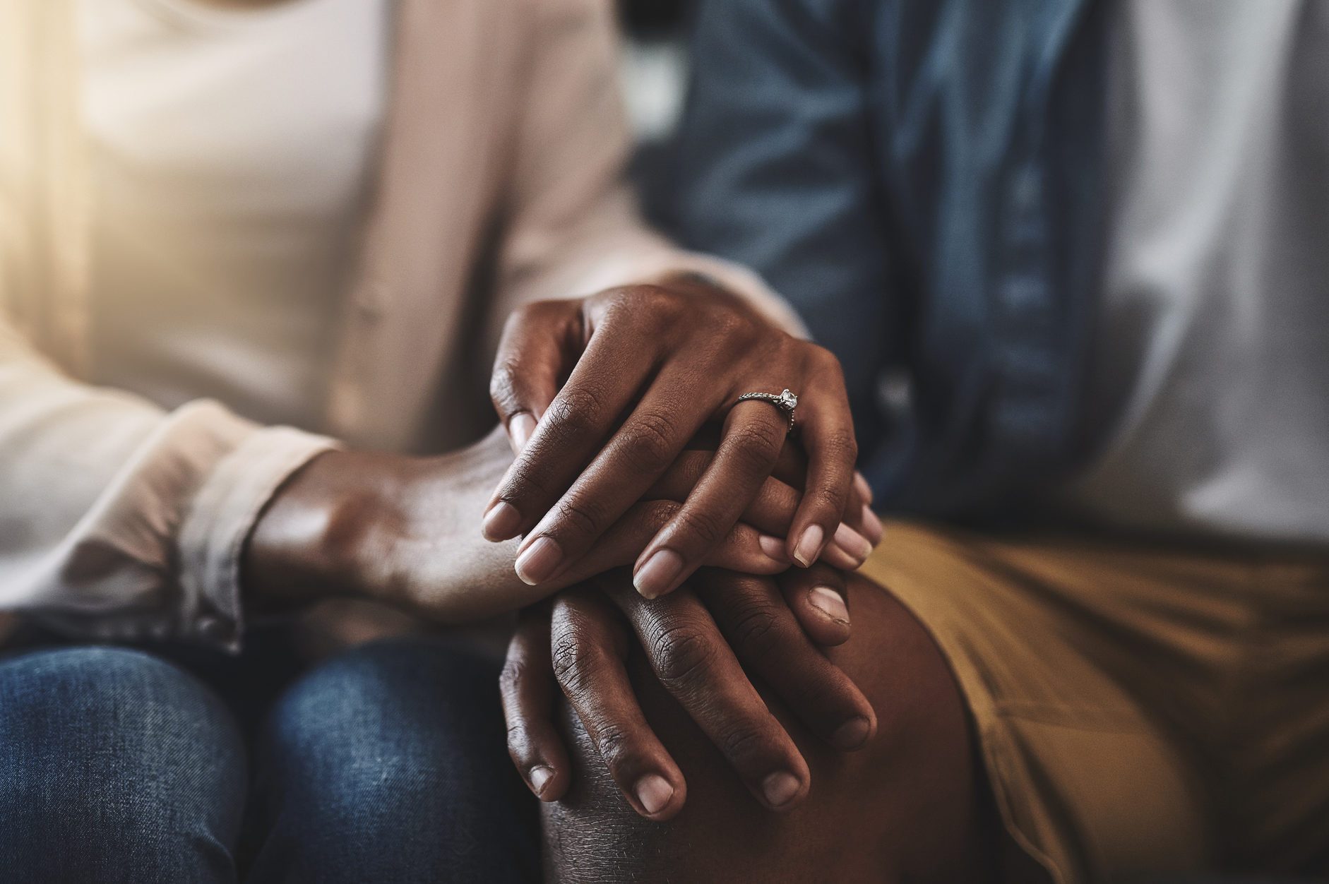 couple with overlapping hands
