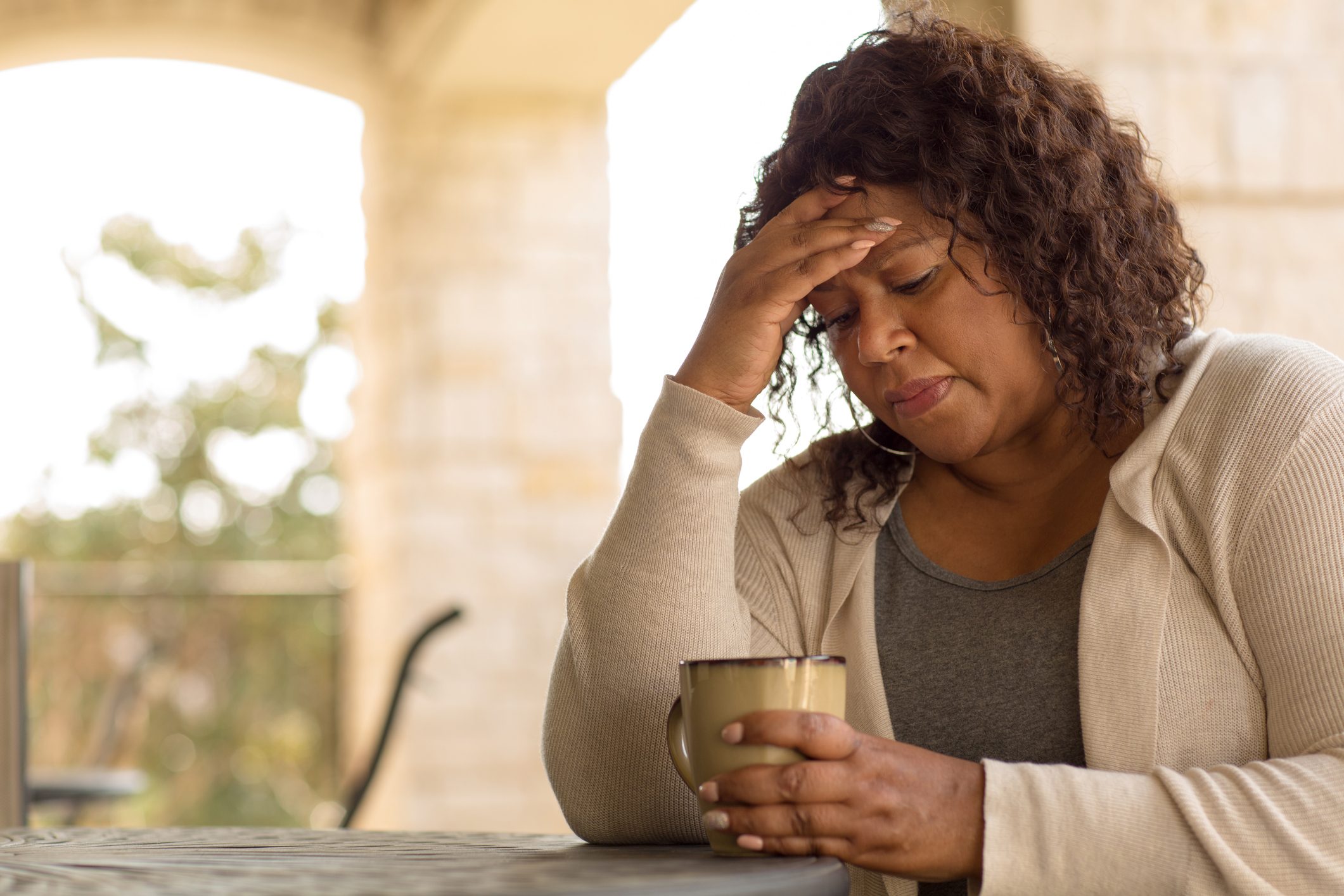 African American middle age woman looking sad.