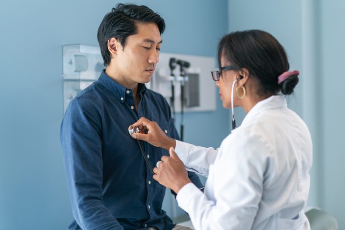 doctor listening to patient's heart