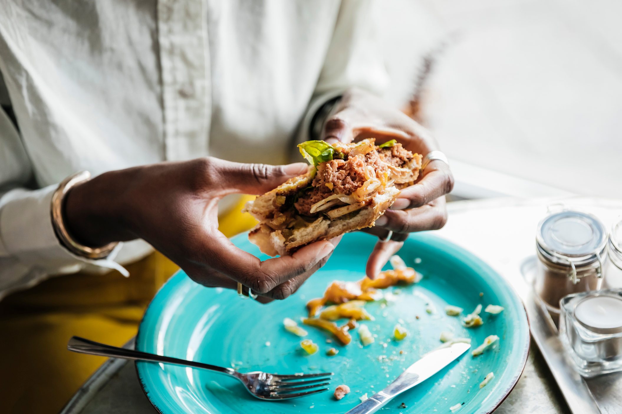 Woman Eating Tasty Vegan Burger