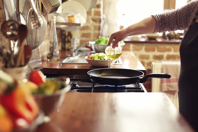 Cooking vegetables, step four, pouring the olive oil